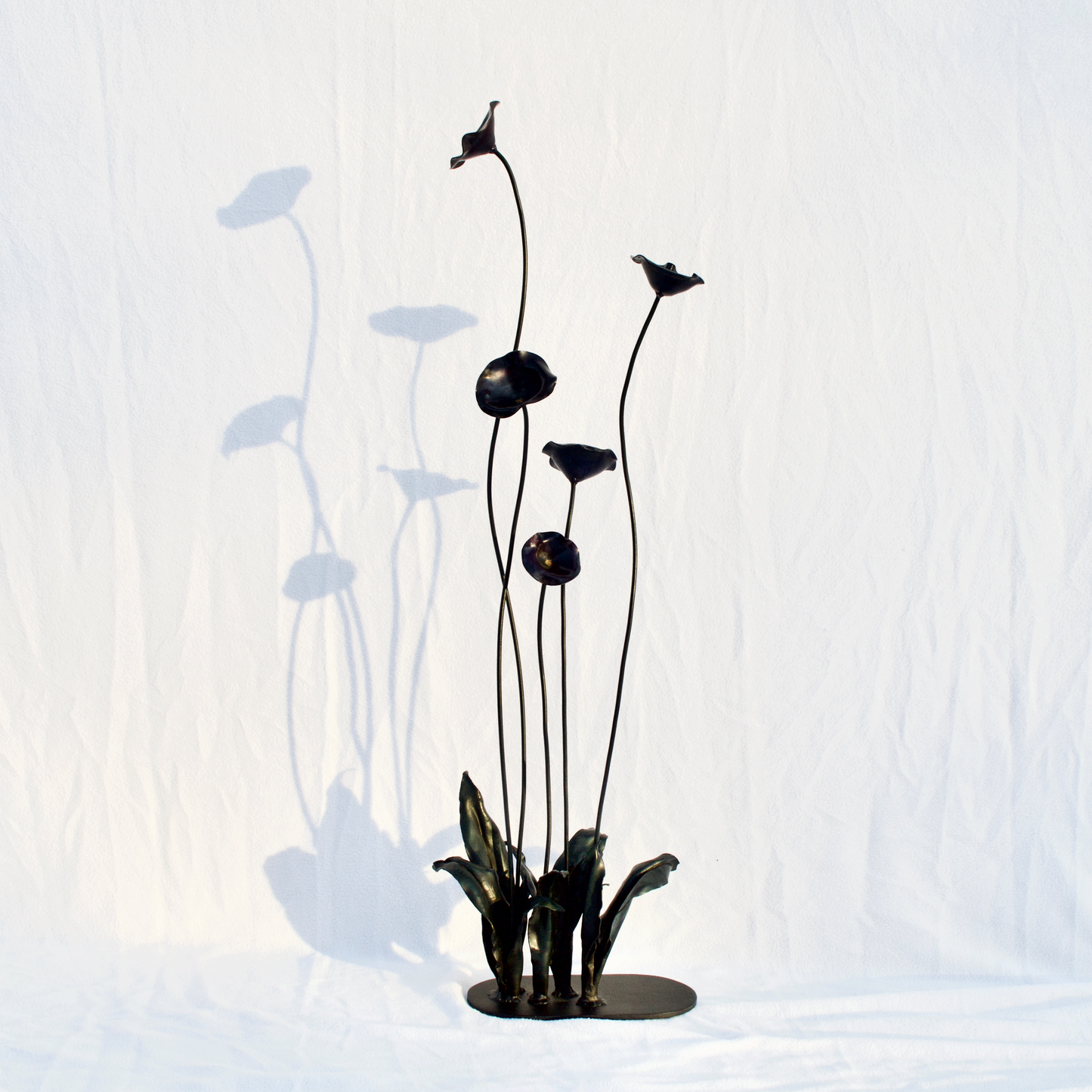 Organic forgesd steel poppy sculpture. 36" tall